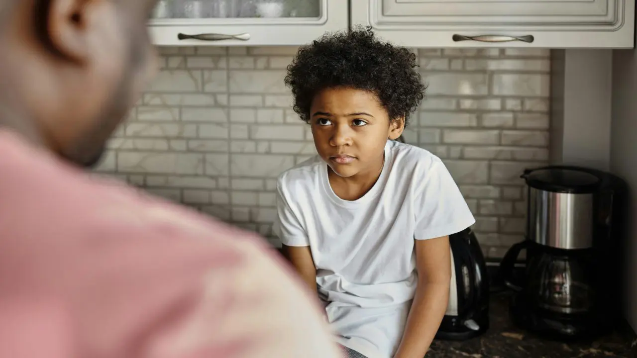 Child looking at adult