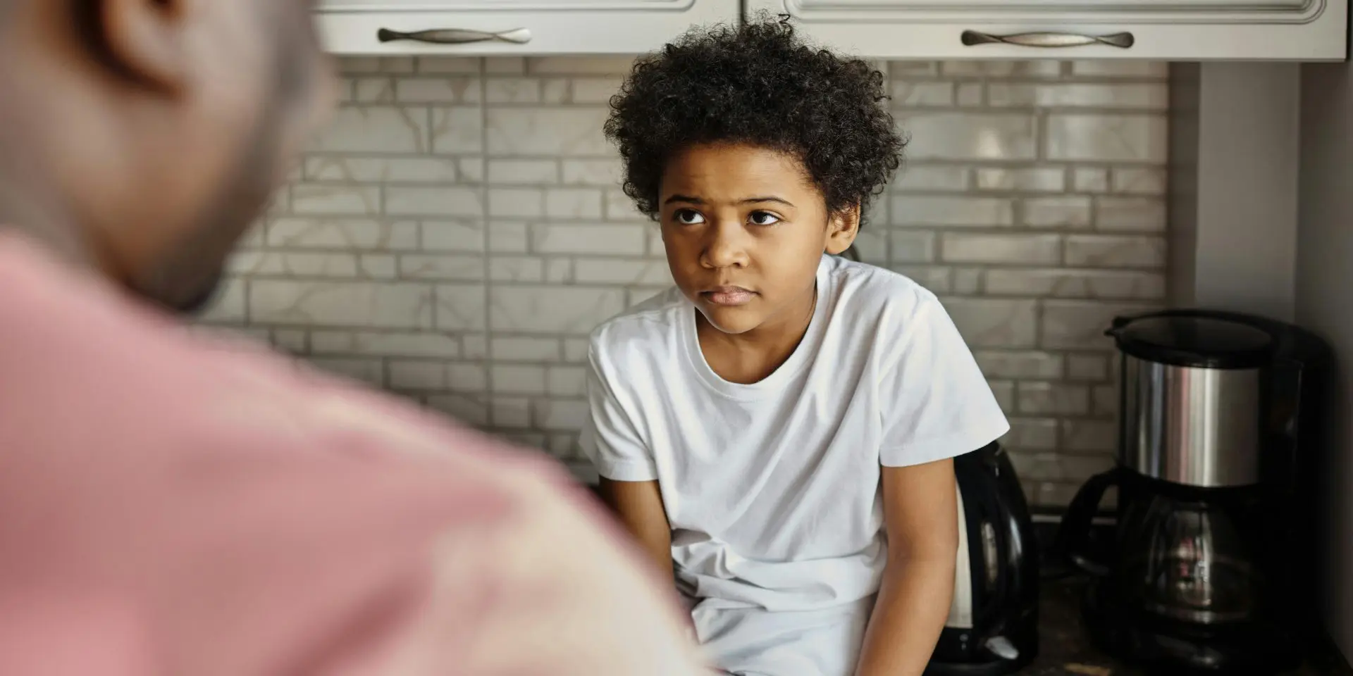 Child looking at adult
