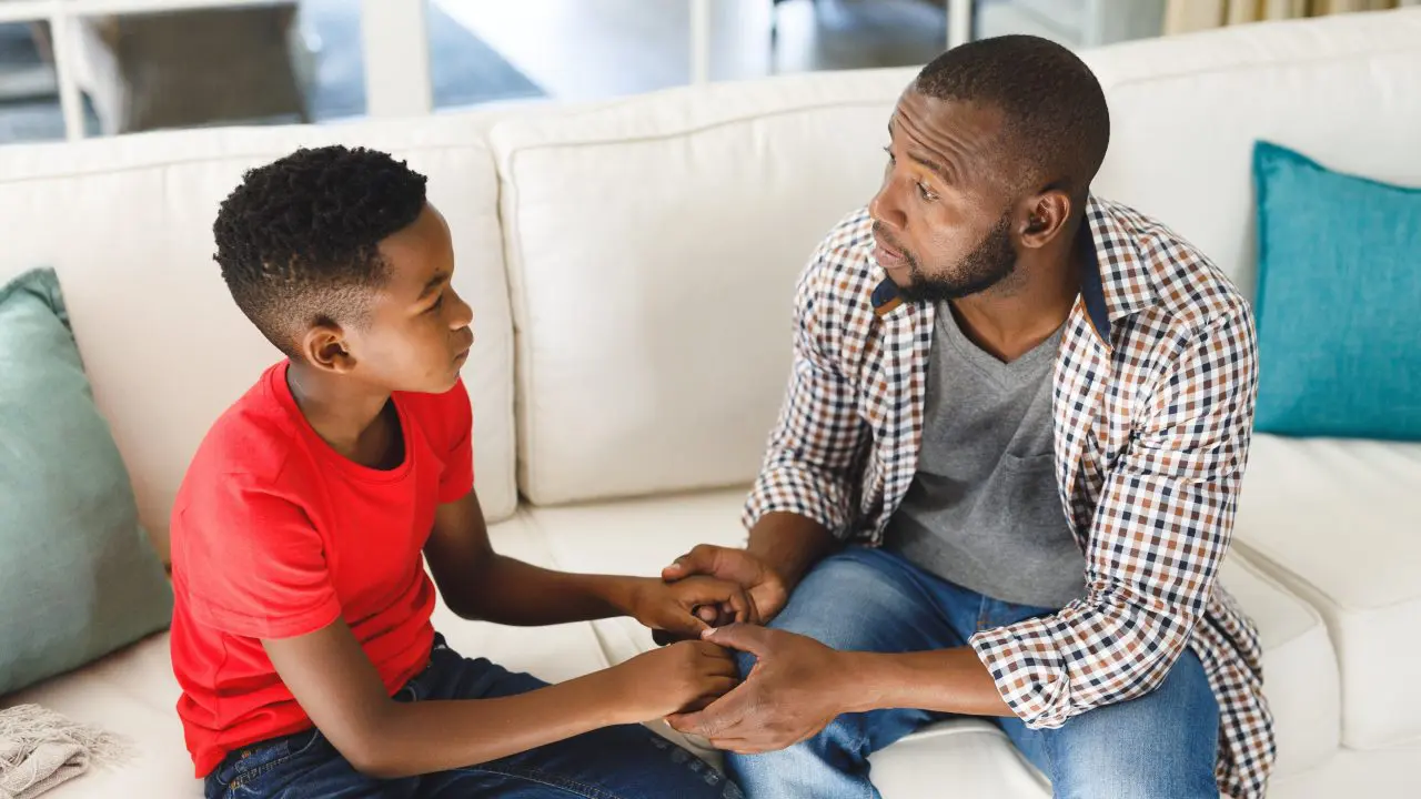 Dad talking with his young son