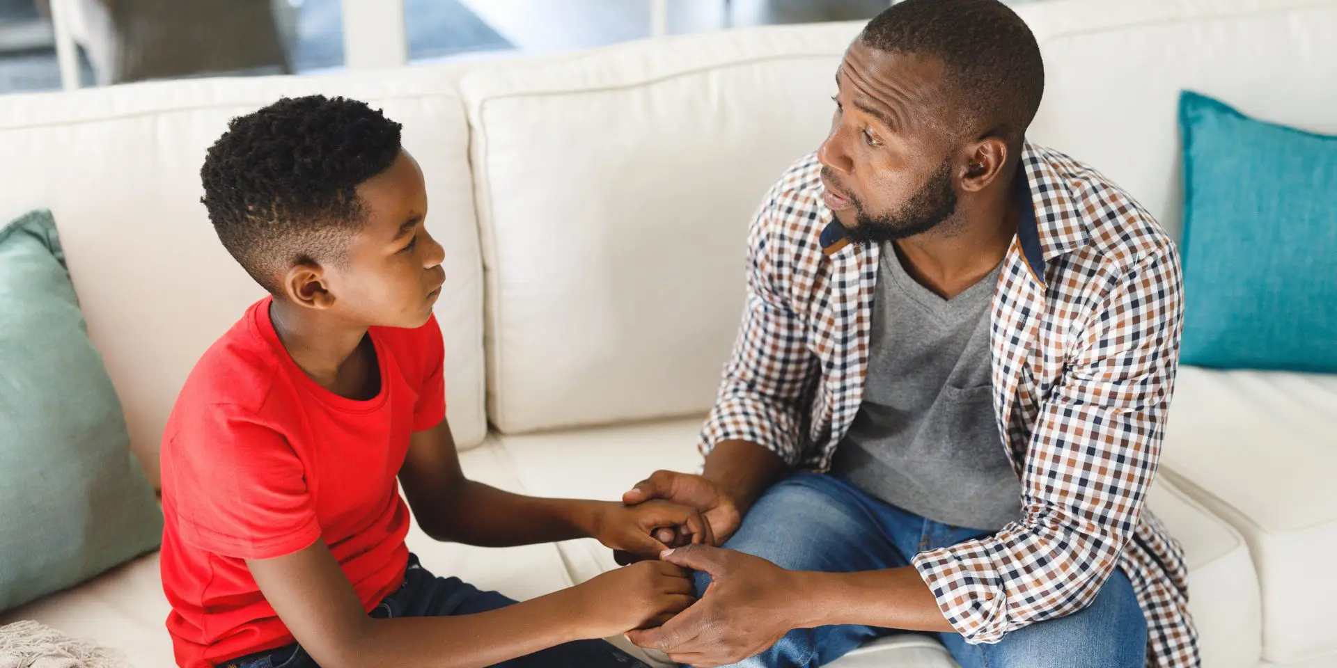 Dad talking with his young son
