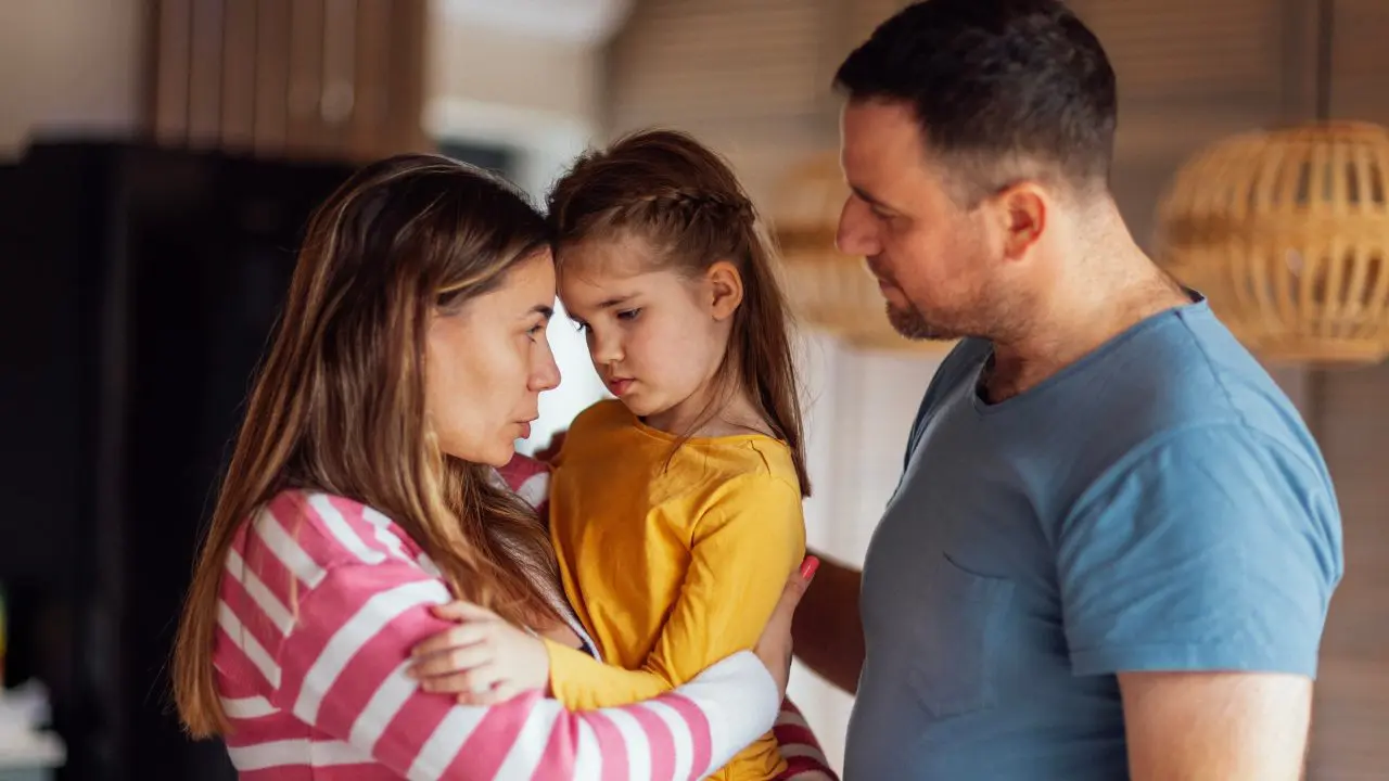 Parents talking to child.