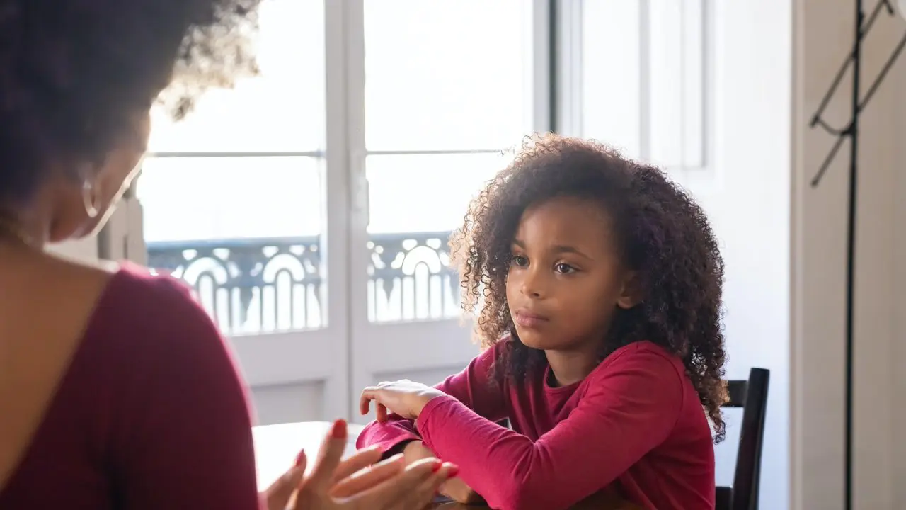 Young child looking to parent who is talking to them.