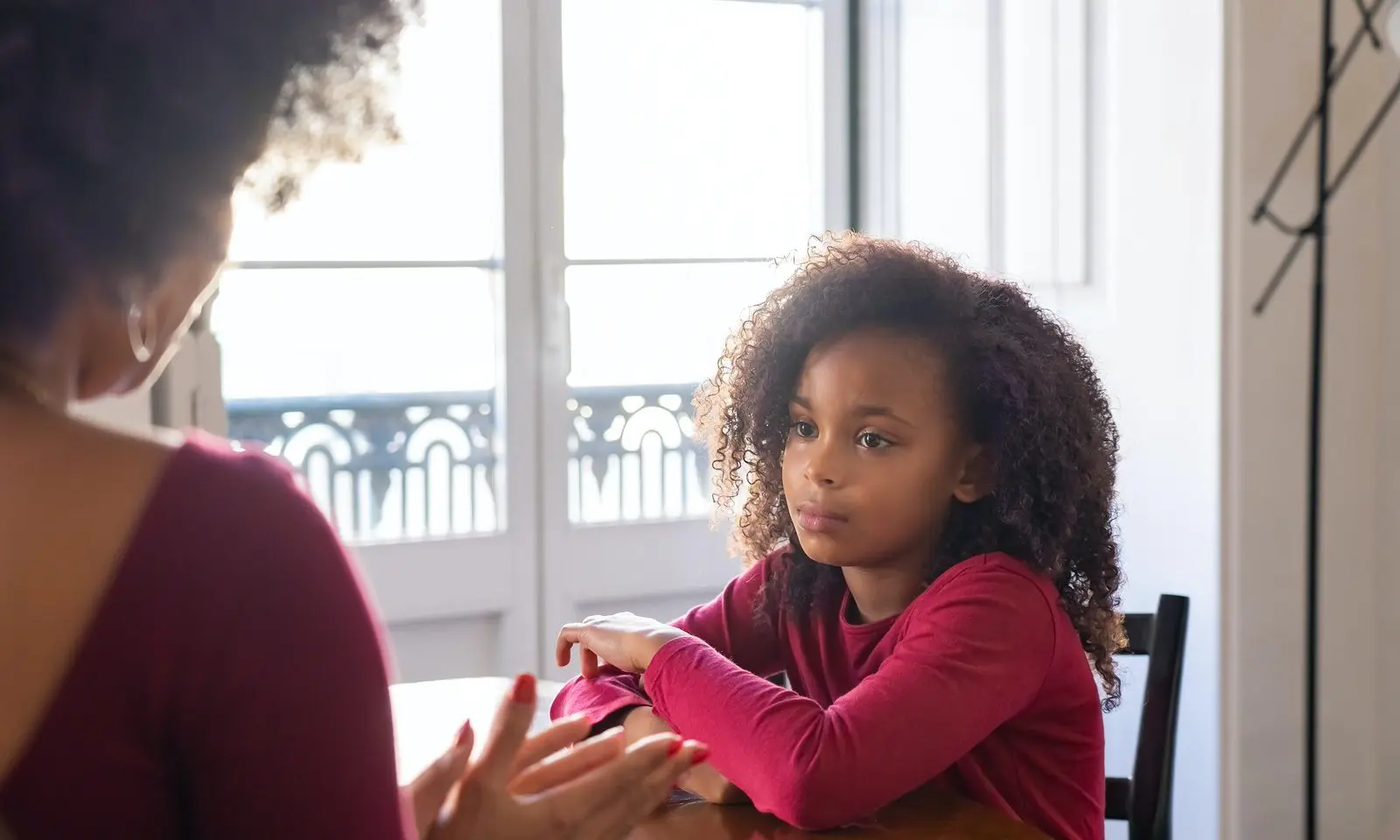 Young child looking to parent who is talking to them.