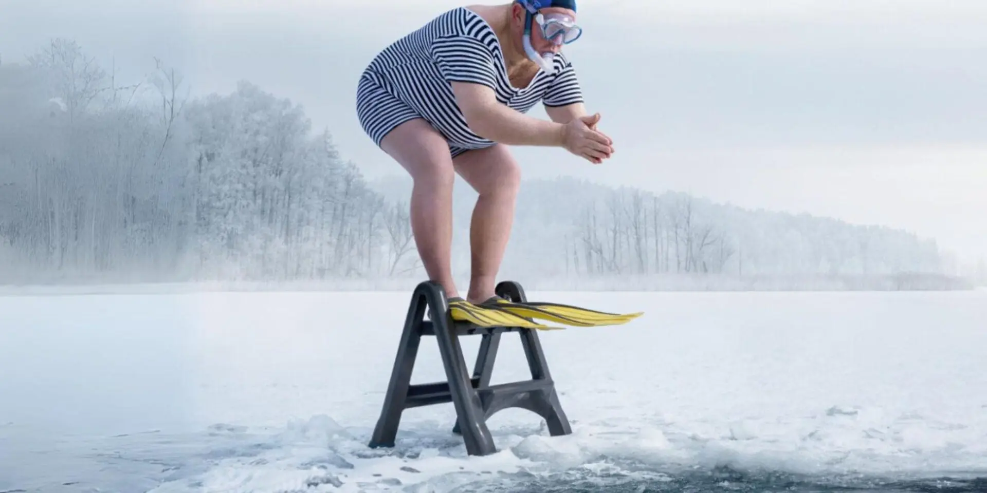 Man diving into an icy lake