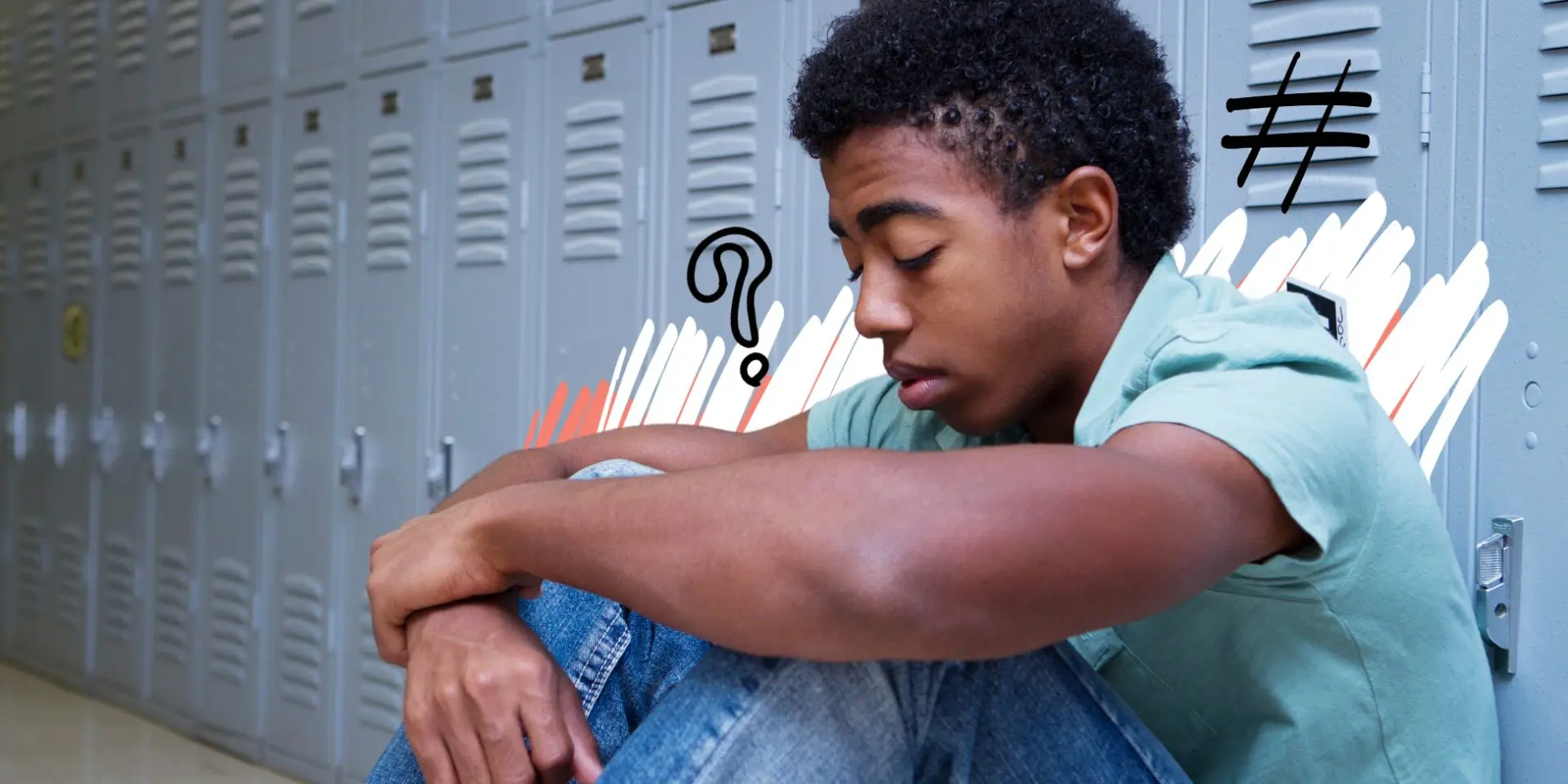 Young male sat beside school lockers, grieving