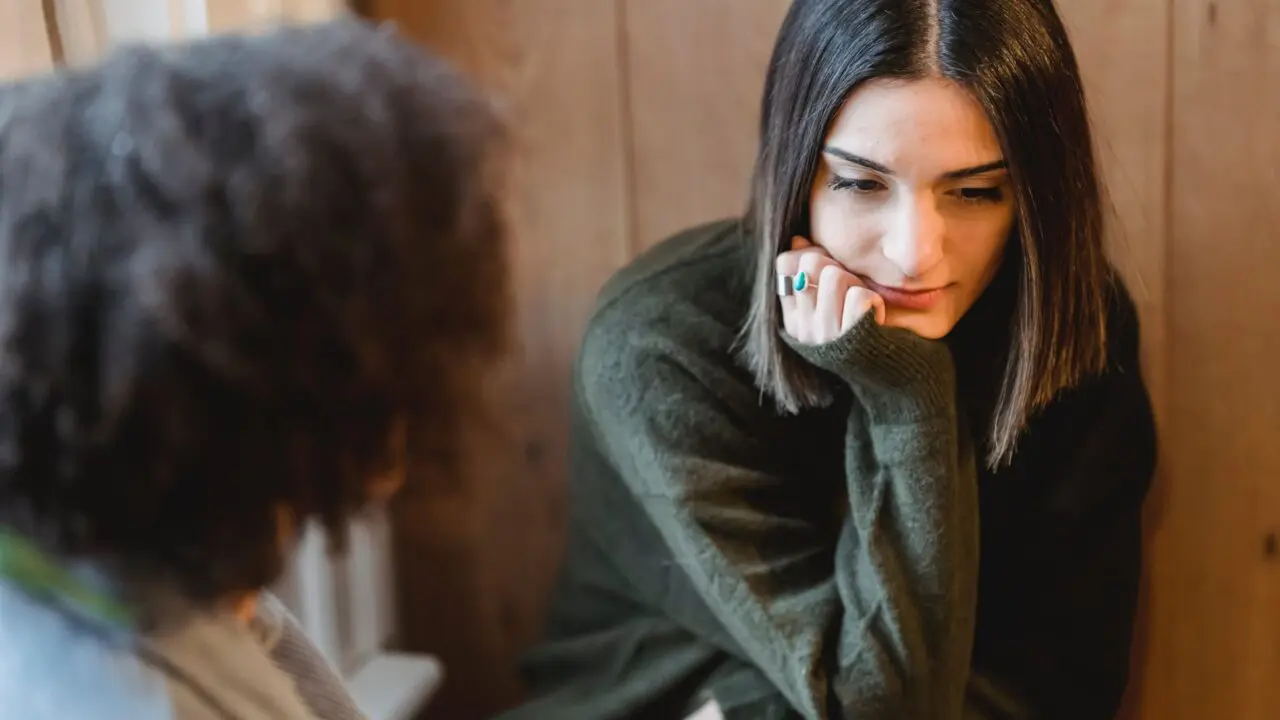 Teenage girl thinking in the middle of a conversation
