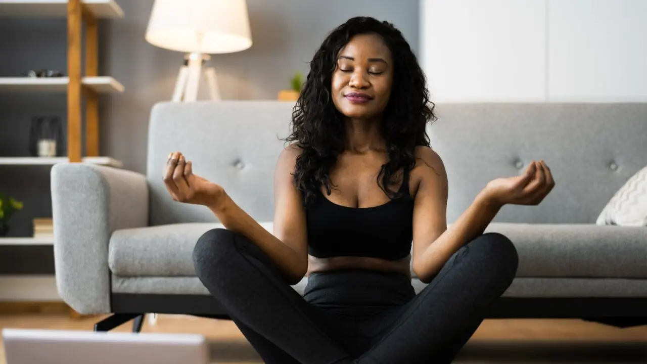 Woman doing yoga in her home