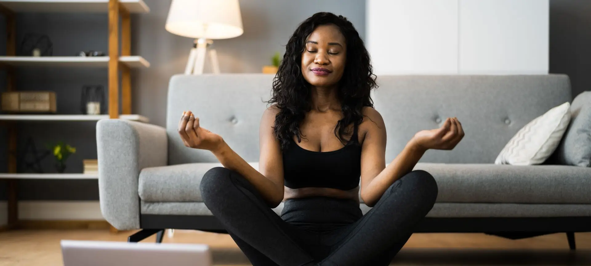 Woman doing yoga in her home
