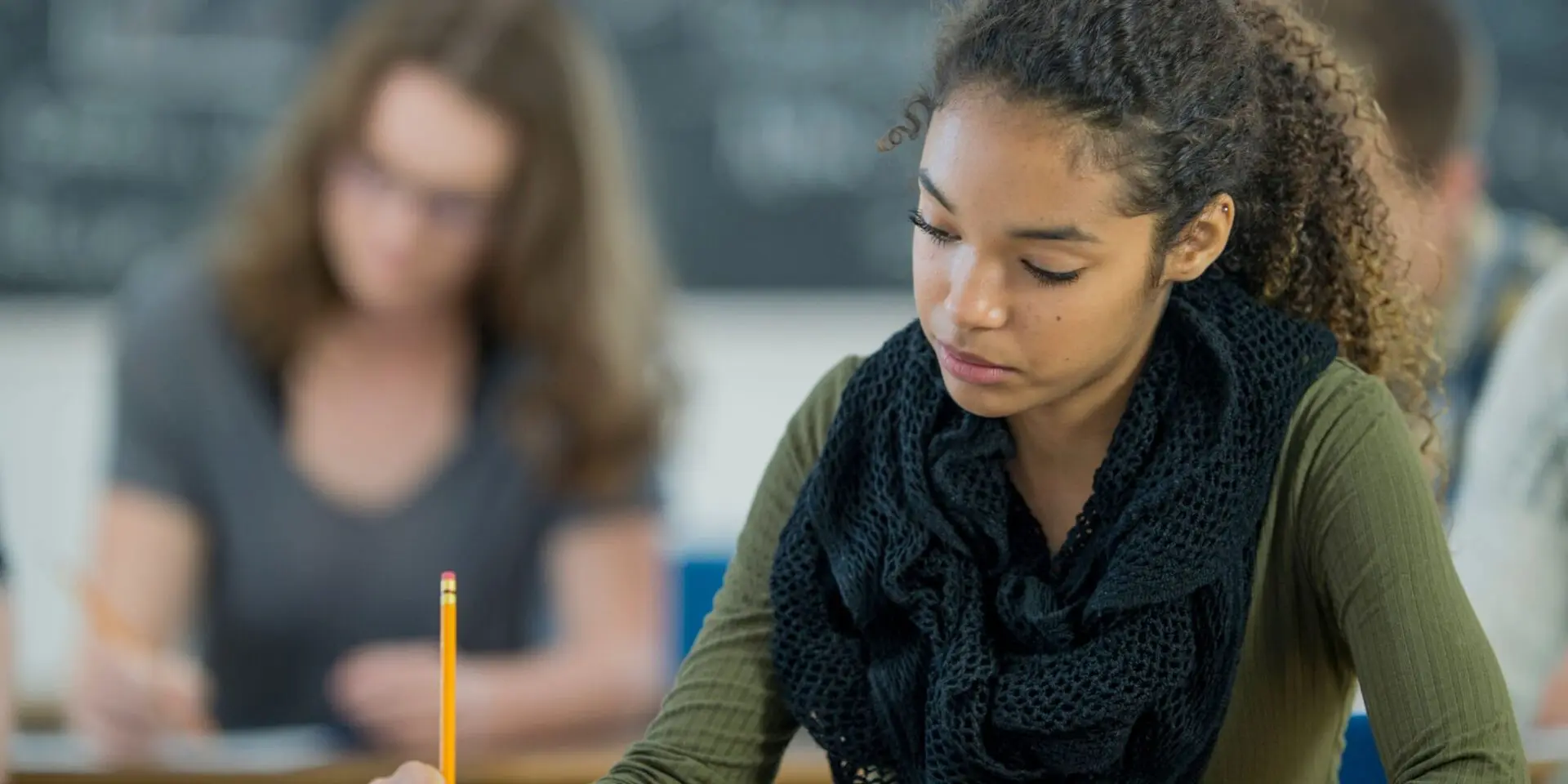 young girl sitting an exam