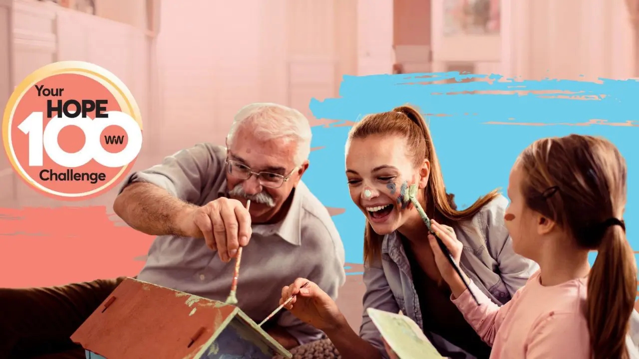 Hope 100 - generic ask, featuring a family of three laughing and painting a wooden house