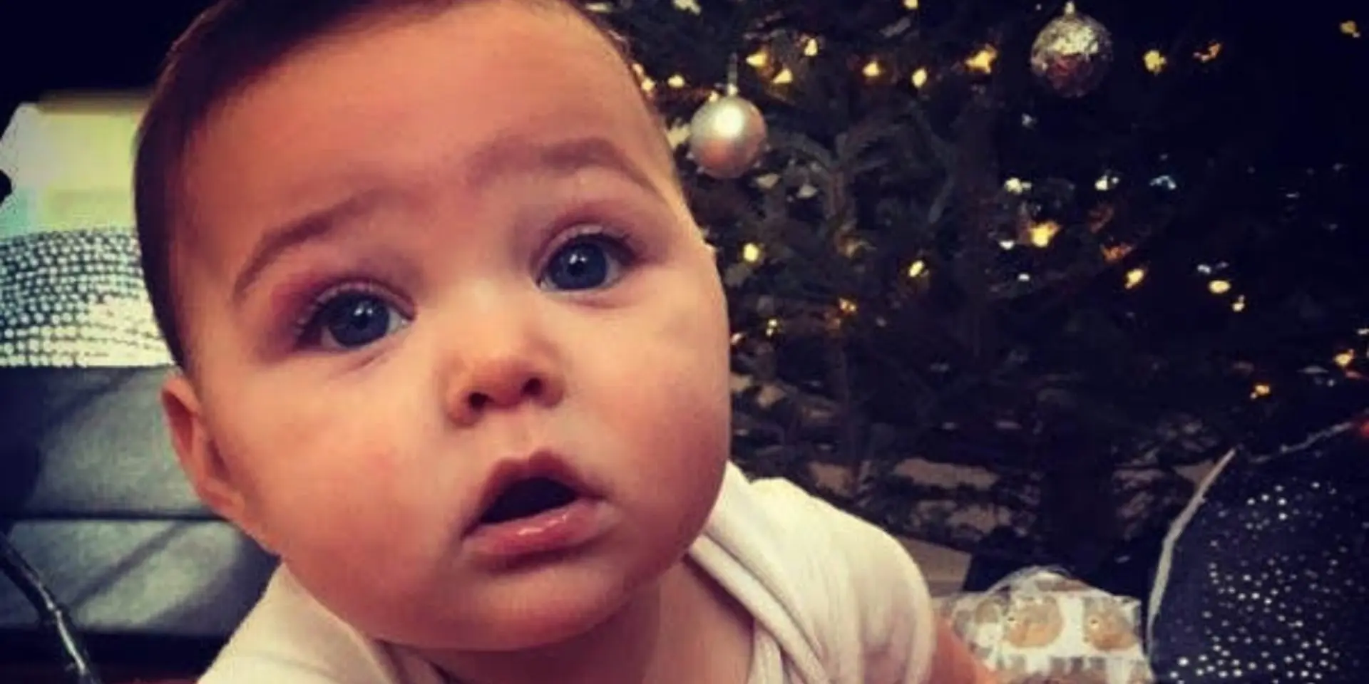 Baby Rocco in front of Christmas tree
