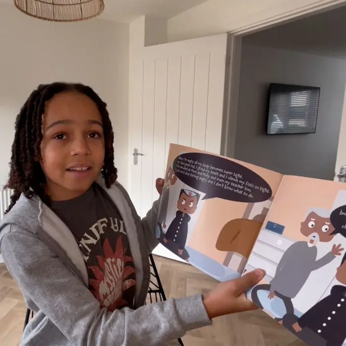 Junior Youth Ambassador Miles with Winston's Wish original book club book on feelings around anger