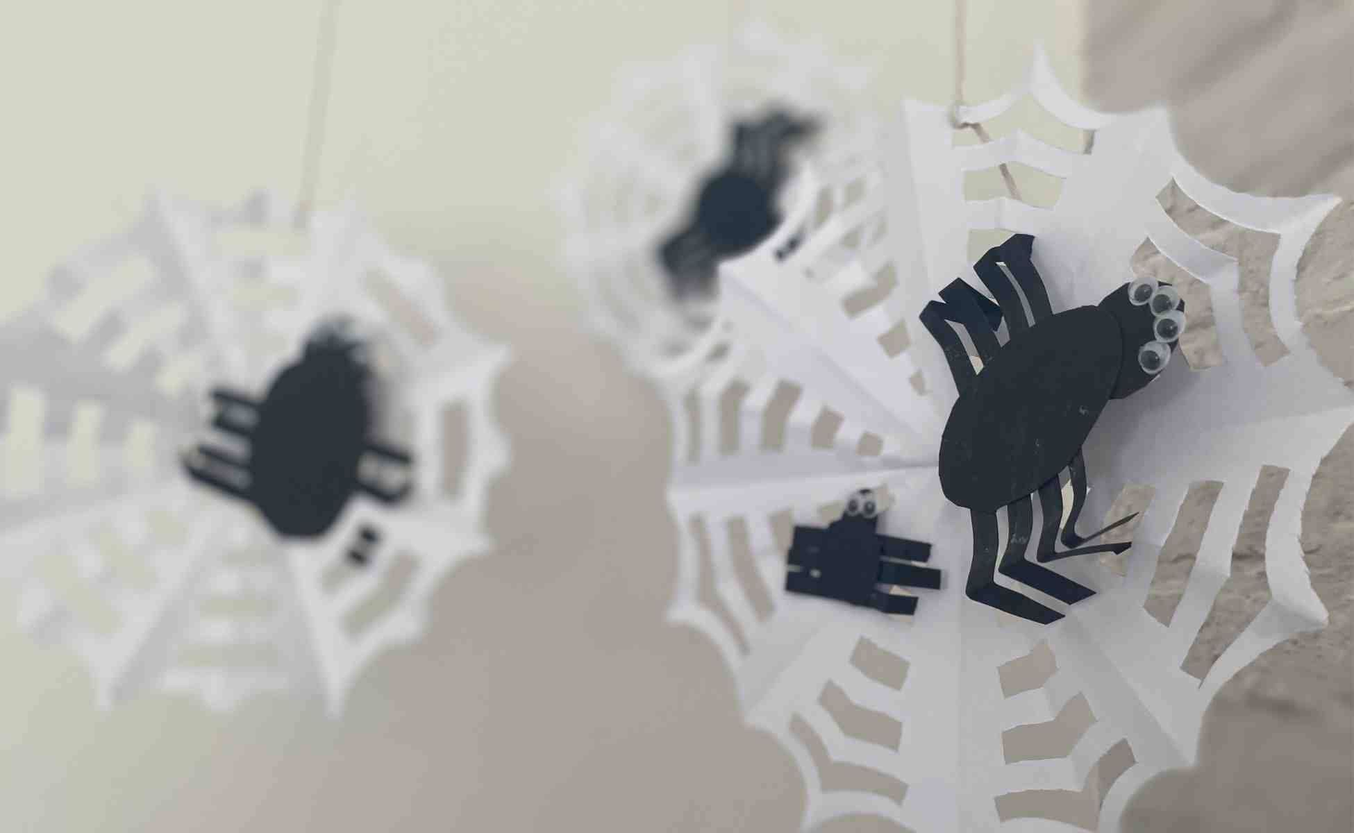 Step 8 Feed the spider legs through the holes of your web to sttach it - Make a spider - Winston's Wish