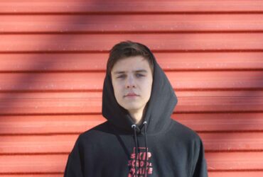 Teenage boy in a hoodie staring at the camera - Winston's Wish Youth Survey